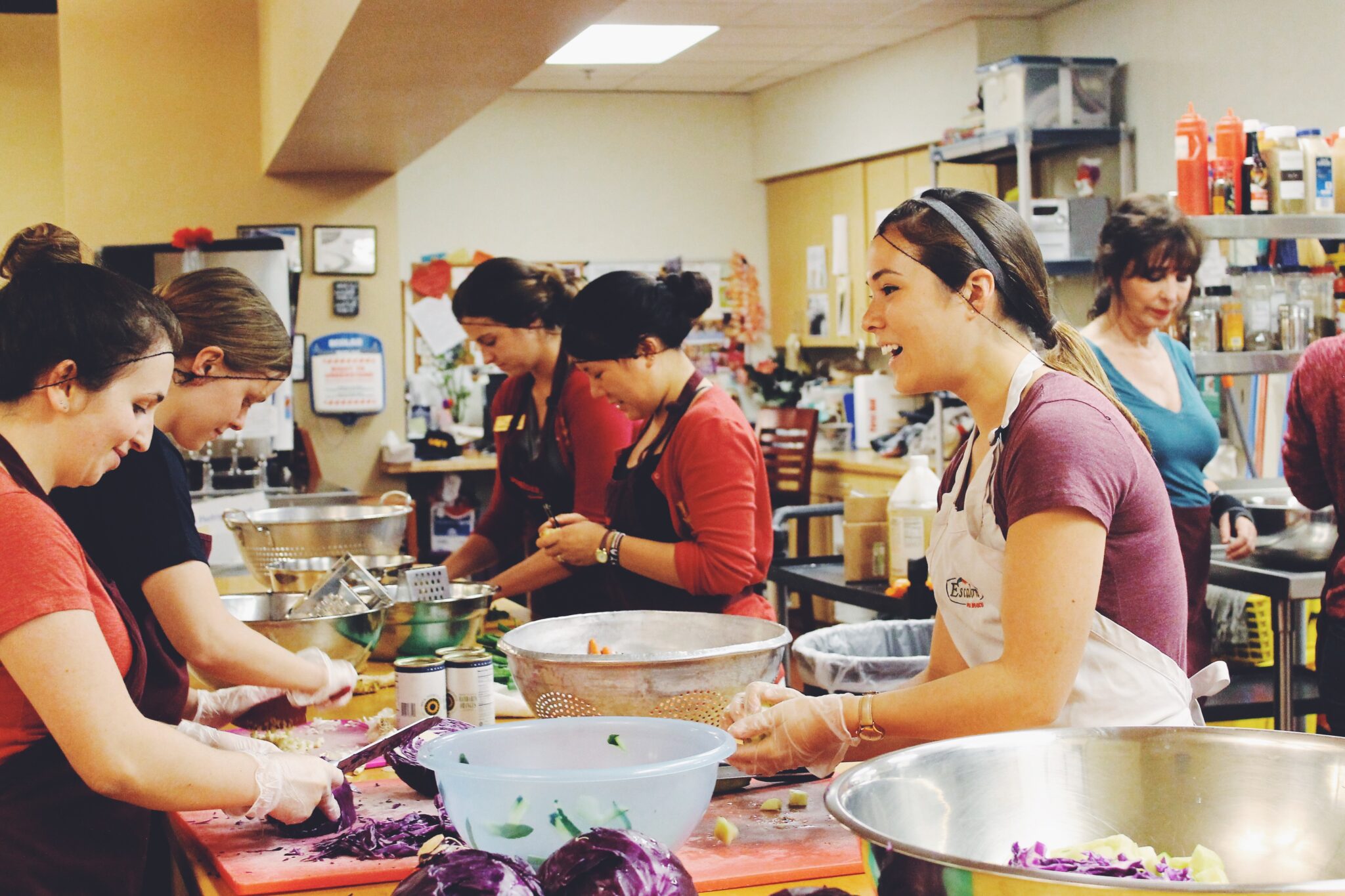 The USC Helenes prepare lunch for the Day Center.