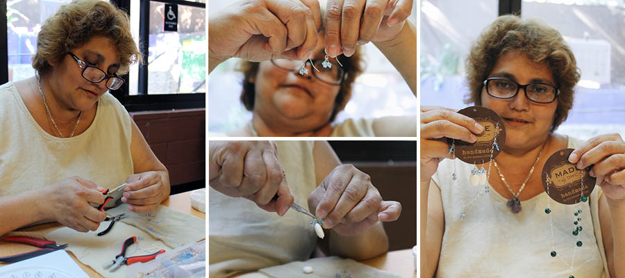  Magdalena T. creates a beautiful new pair of earrings (and a necklace to match!) in DWC's jewelry-making workshop.